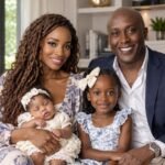 Gerald Mwangi with Shamea Morton and their two daughters in a family portrait
